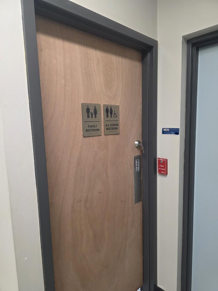 New commercial restroom door with deadbolt and ADA signage
