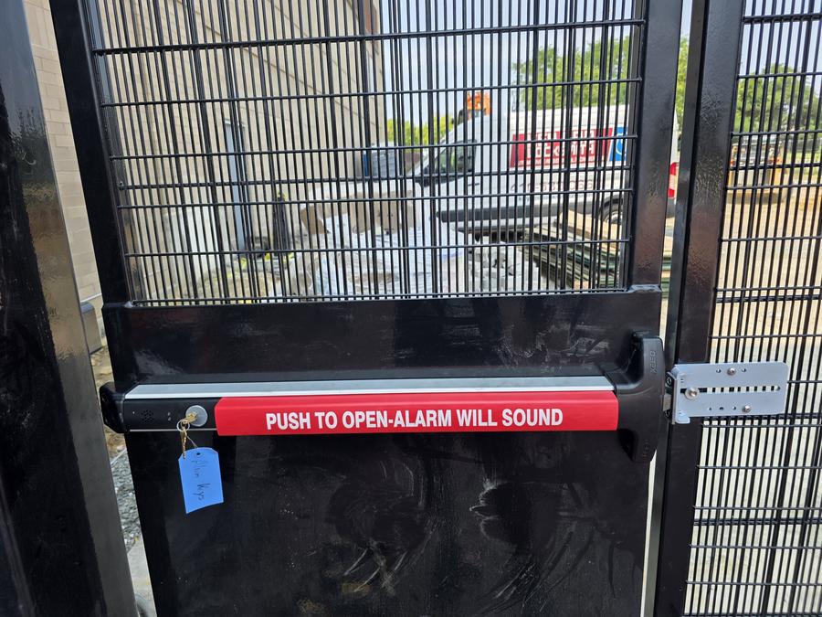Commercial panic exit hardware on a gate